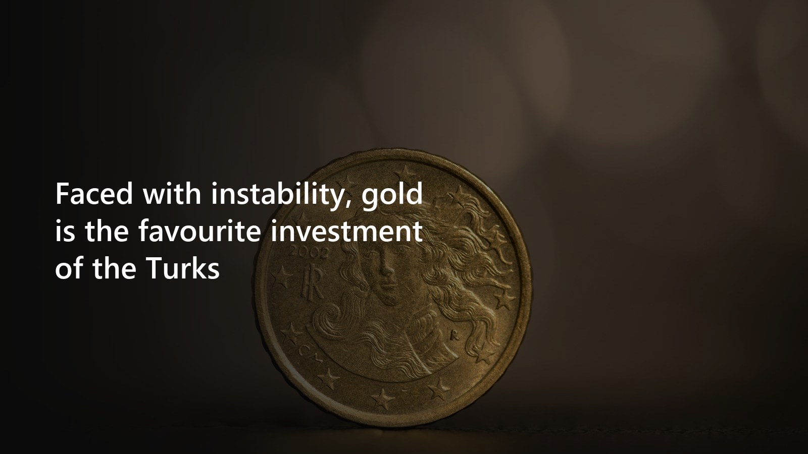 Gold coins and a bar shown in close-up